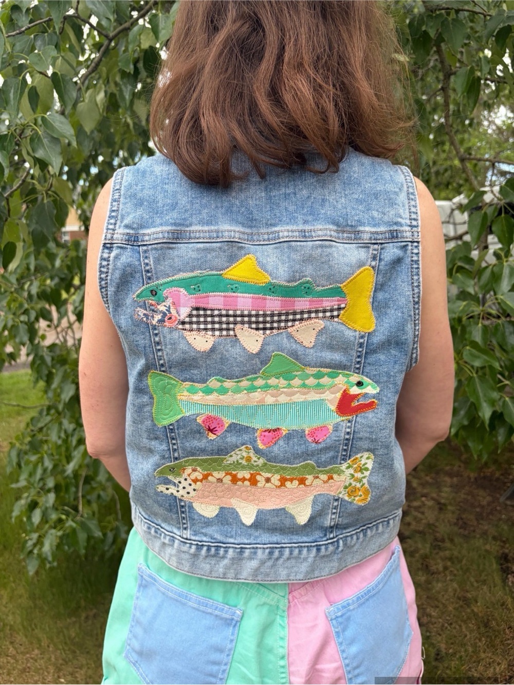 Upcycled jean vest with 3 quilted neon fish on the back size XS